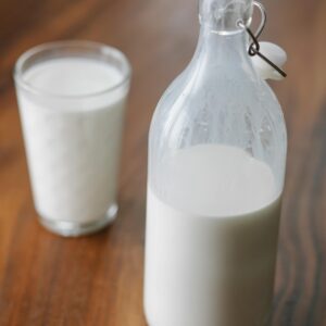 Bottle and glass of milk at home